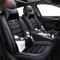 Cojín de asiento de coche de cuero negro de PVC / PU de nuevo diseño universal con almohada de cintura de dibujos animados